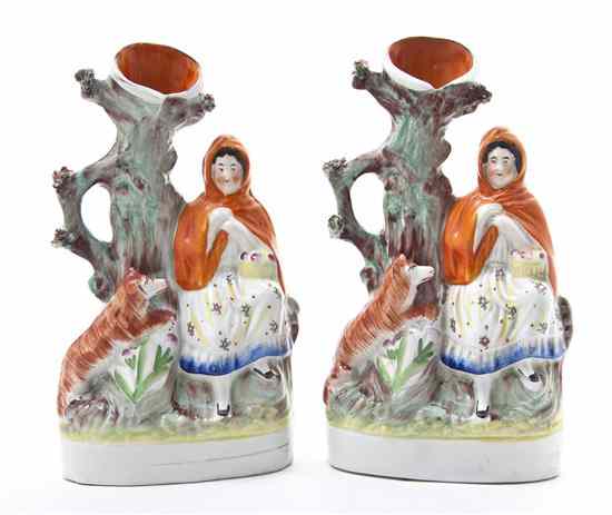 Appraisal: A Pair of Staffordshire Figural Spill Vases each depicting a