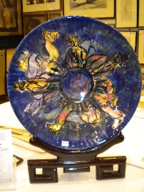 Appraisal: ELIZABETH PRIOR BURKE AND WILLS CERAMIC PLATE ON A STAND