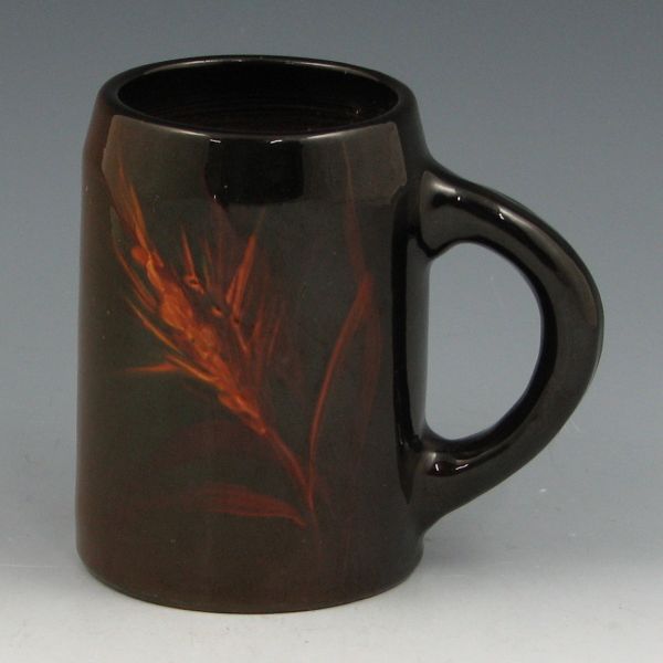 Appraisal: Weller standard glaze mug with wheat decoration While resembling Louwelsa