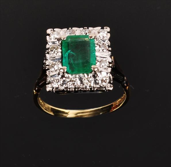 Appraisal: A emerald and diamond ring set to the centre with