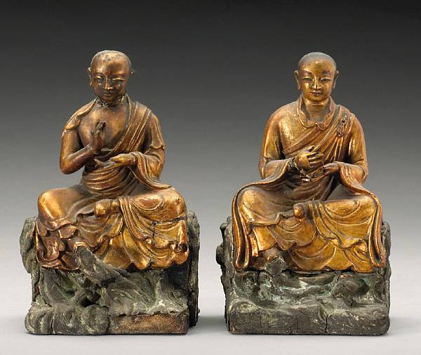 Appraisal: A pair of gilt lacquered wood seated luohan th Century