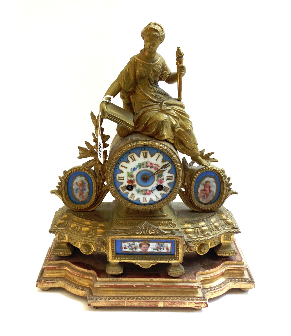 Appraisal: A French gilt metal figural mantel clock late th century