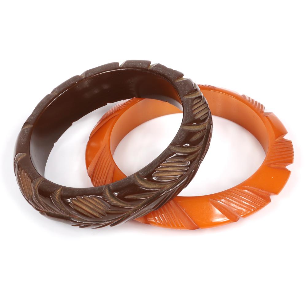 Appraisal: TWO VINTAGE DEEPLY CARVED BAKELITE BANGLE BRACELETS IN BUTTERSCOTCH TOFFEE