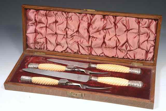 Appraisal: A CASED SILVER MOUNTED IVORY HANDLED CARVING SET CONSISTING OF