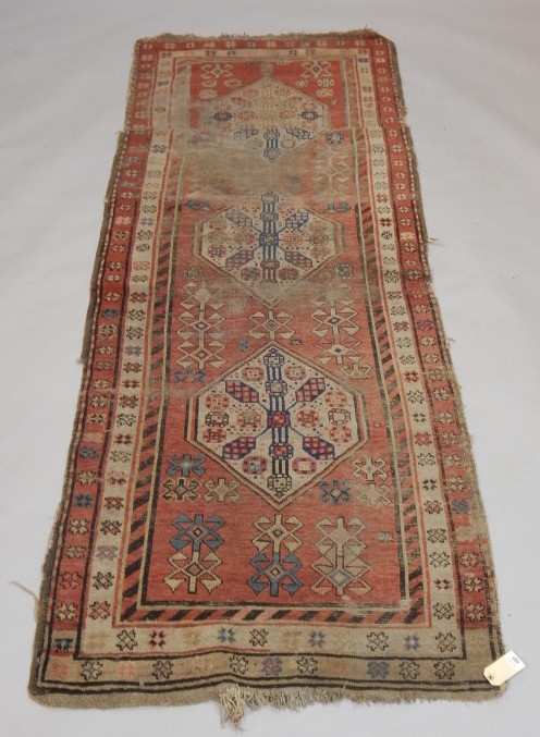 Appraisal: A Persian runner with a central pole medallion on a