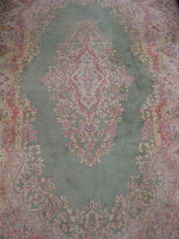 Appraisal: Kerman Persian Handmade Rug soft floral colors on light green