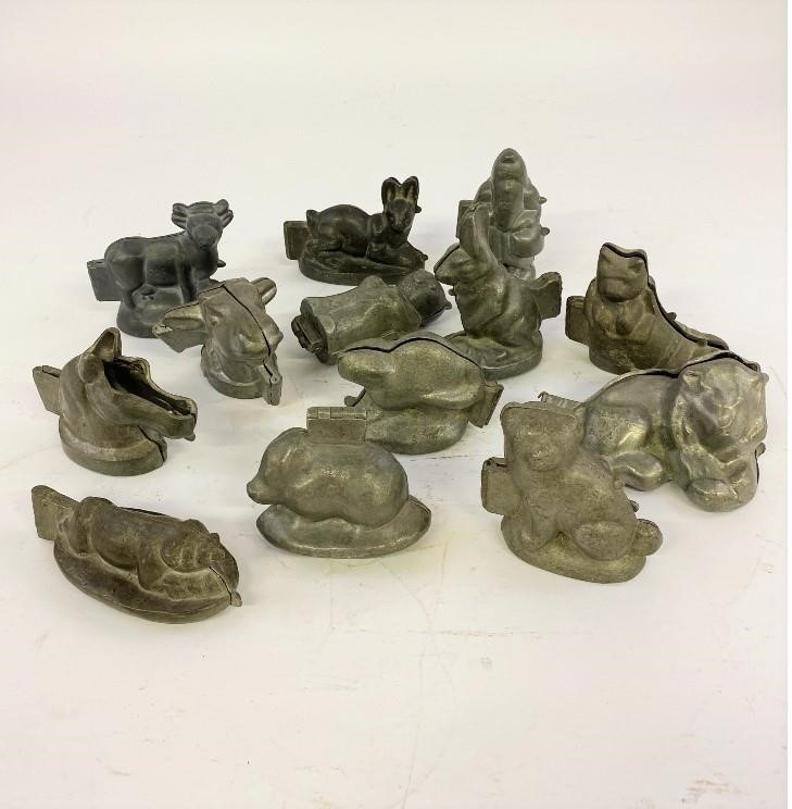 Appraisal: Thirteen pewter animal and Santa ice cream molds by E