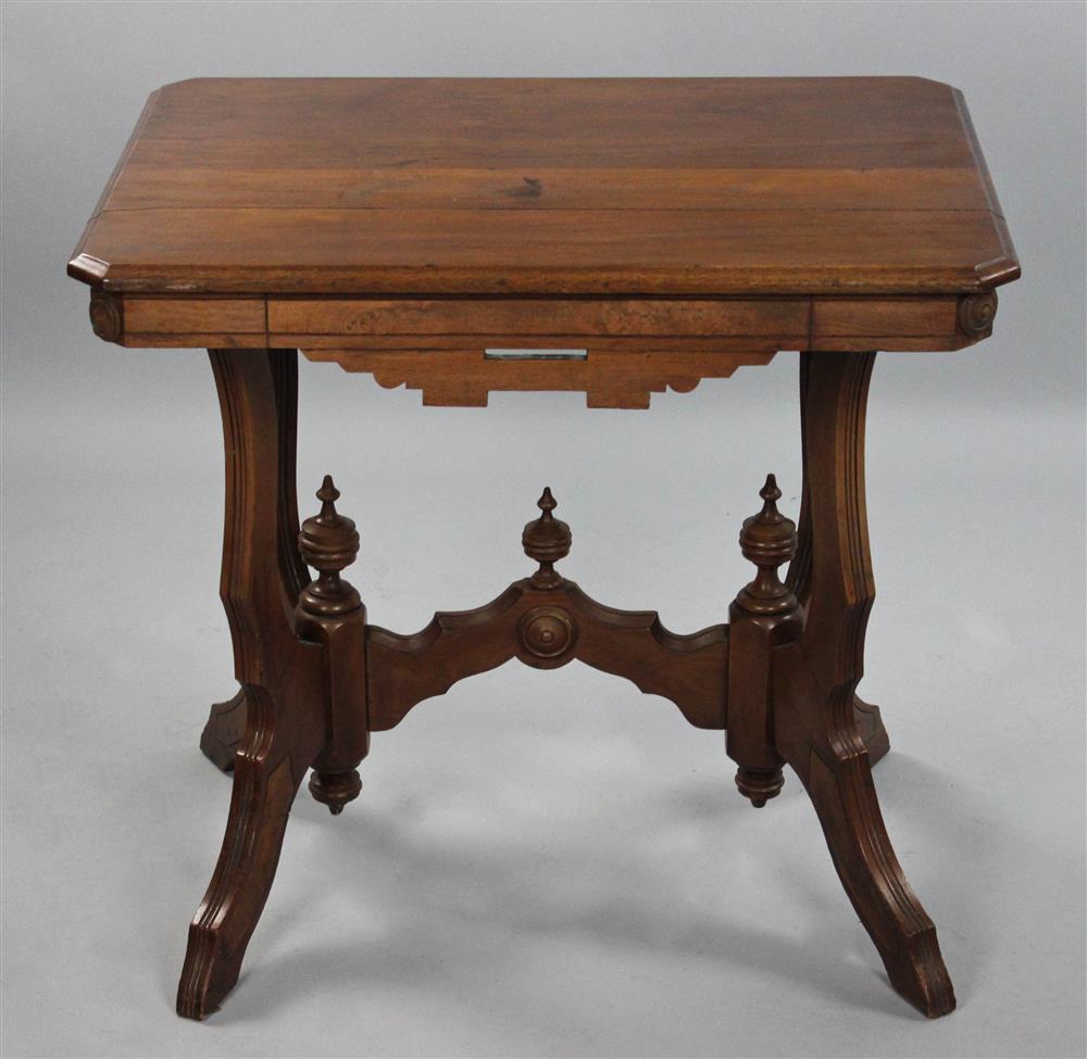 Appraisal: EASTLAKE STYLE WALNUT SIDE TABLE the rectangular top with molded