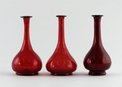 Appraisal: Three ruby-flashed glass bottle vases with flared necks th century