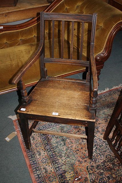 Appraisal: A GEORGE III COUNTRY OAK ELBOW CHAIR with rail back