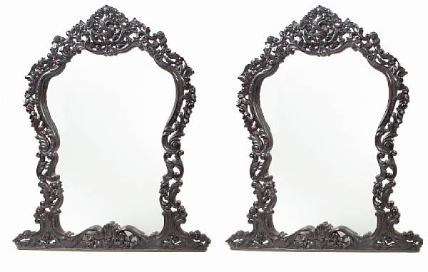 Appraisal: A pair of Baroque style carved hardwood mirrors height ft