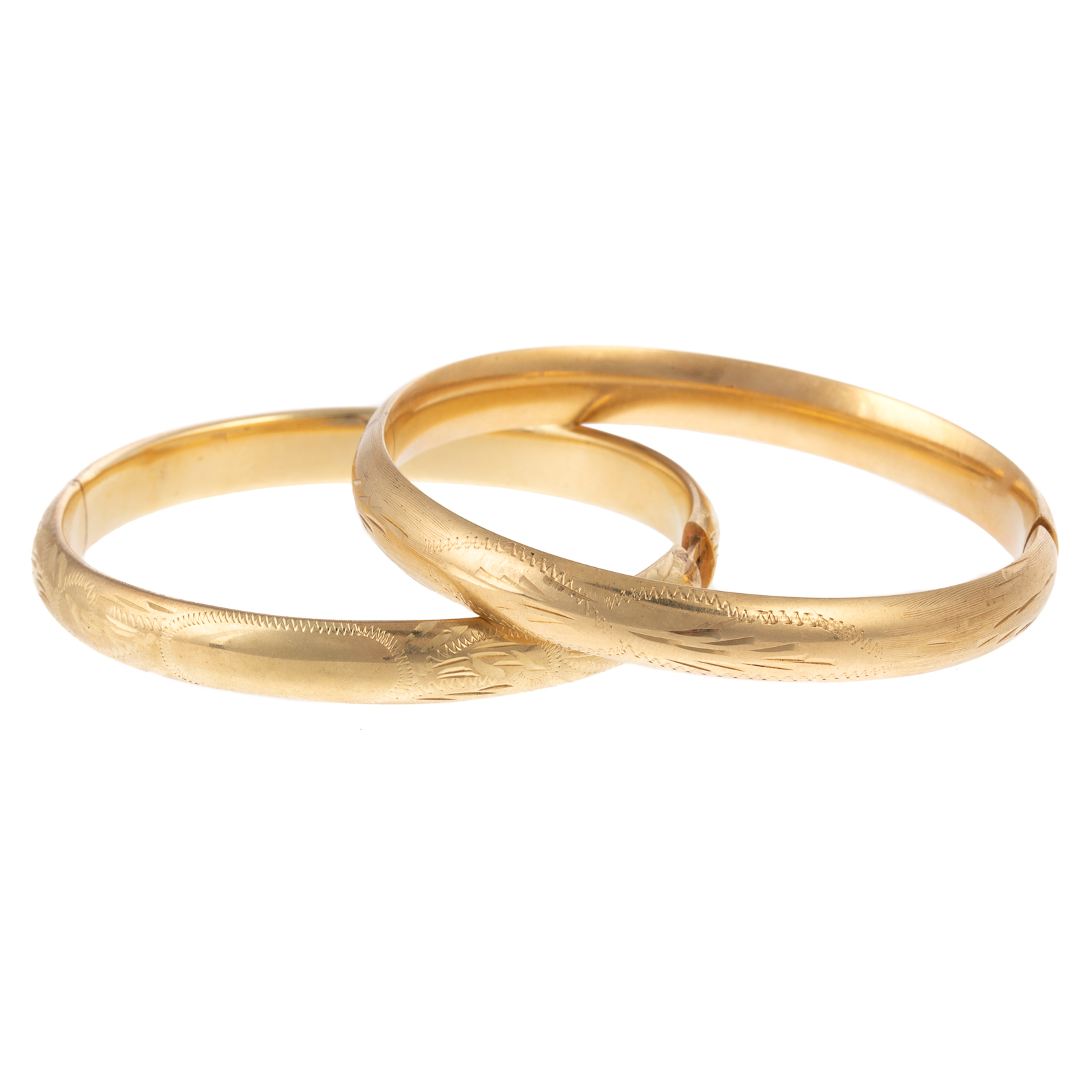 Appraisal: TWO K YELLOW GOLD BANGLE BRACELETS K yellow gold engraved