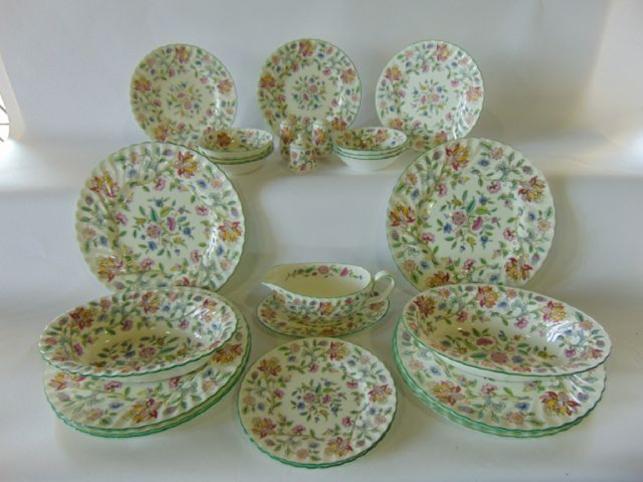 Appraisal: A quantity of Minton's Haddon Hall pattern dinner wares comprising