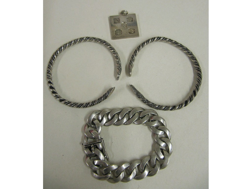 Appraisal: Lot comprising a silver curb link bracelet silver ingot and