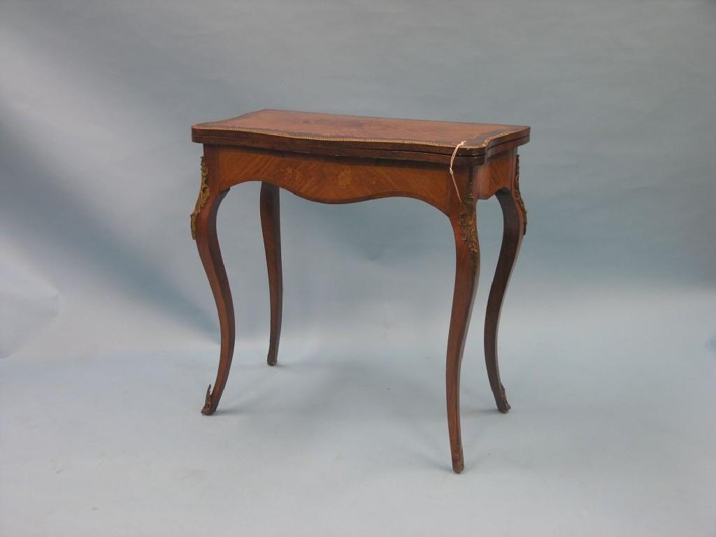 Appraisal: A Louis XV-style mahogany rosewood and marquetry card table serpentine-shape