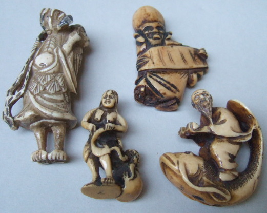 Appraisal: A group of four ivory netsuke th century comprising a