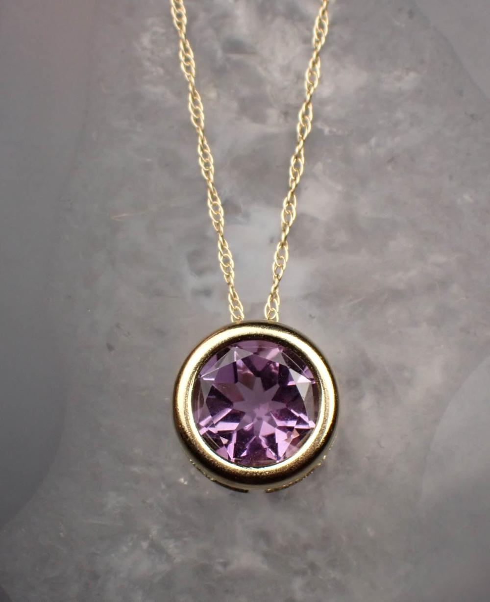 Appraisal: AMETHYST AND FOURTEEN KARAT GOLD PENDANT NECKLACE with an dainty