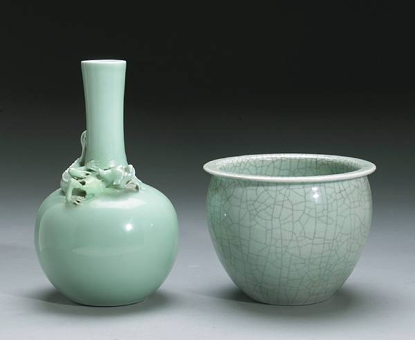 Appraisal: A celadon glazed stick neck vase with applied dragon decoration