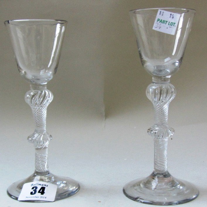 Appraisal: Two similar airtwist wine glasses circa each with a rounded