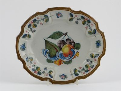 Appraisal: A Nove fa ence dish with scalloped rim painted with