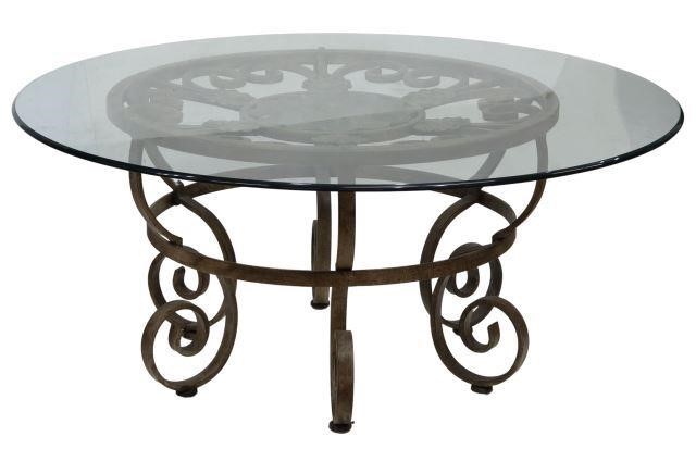 Appraisal: Wrought iron coffee table late th c glass top over