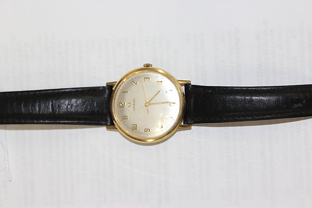 Appraisal: AN OMEGA GENT'S WRISTWATCH with silvered dial gilt Arabic numerals