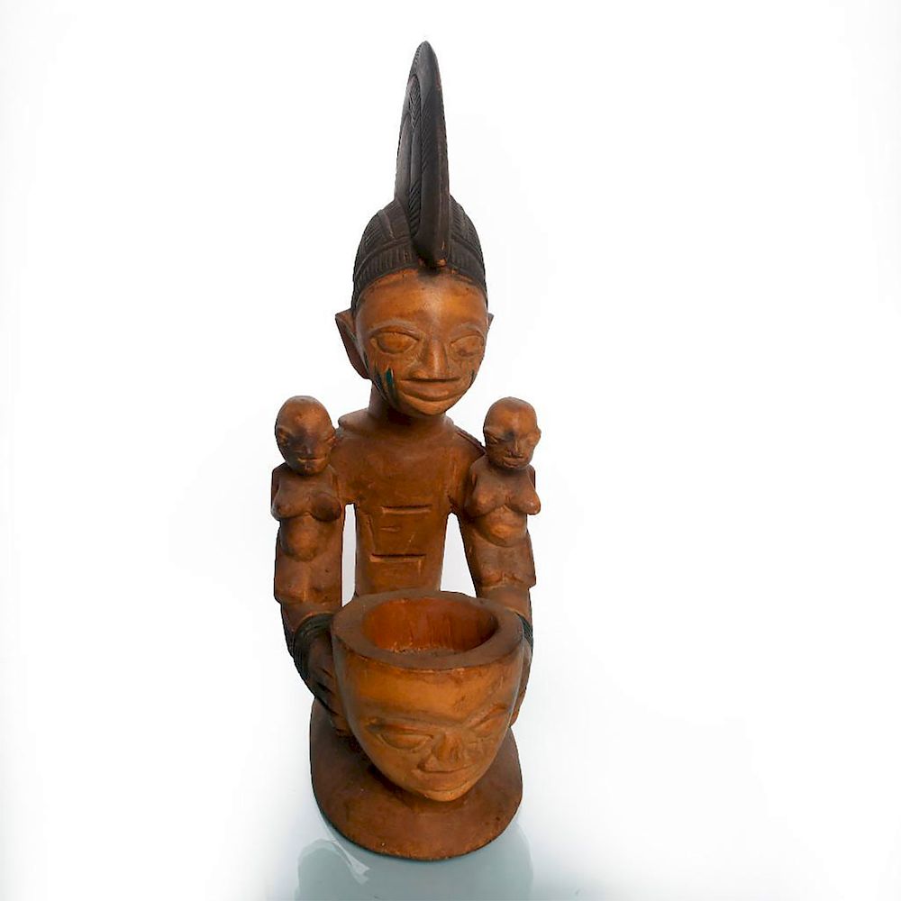 Appraisal: NIGERIAN TRIBAL WOOD SCULPTURE OF WOMAN AND MOLTAR Hand carved