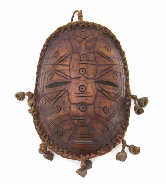 Appraisal: A Lega Turtle Shell Mask the edges with tied rope