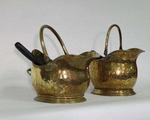 Appraisal: Two brass helmet shaped coal scuttles cm '' wide and