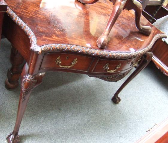 Appraisal: A George III style mahogany side table the serpentine top