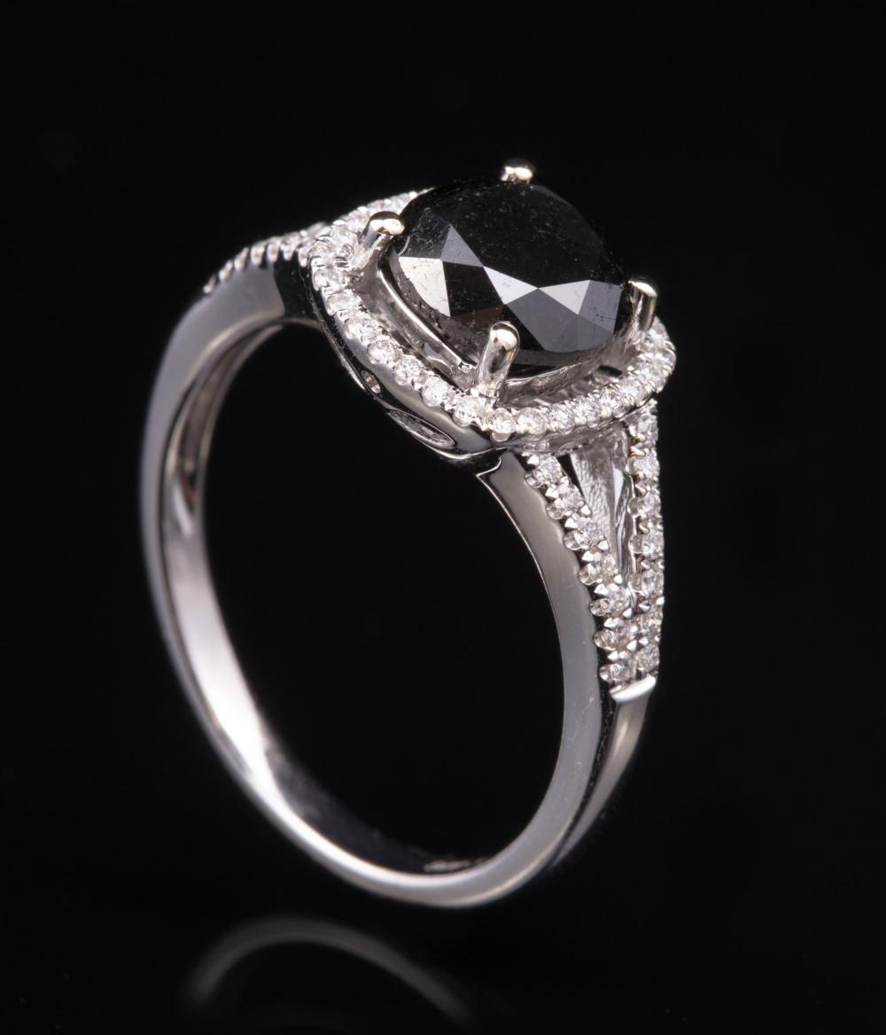 Appraisal: kt White Gold Black Diamond and Diamond Ring center round