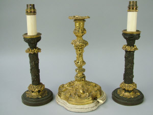 Appraisal: A pair of French gilt bronze candlesticks th century cast