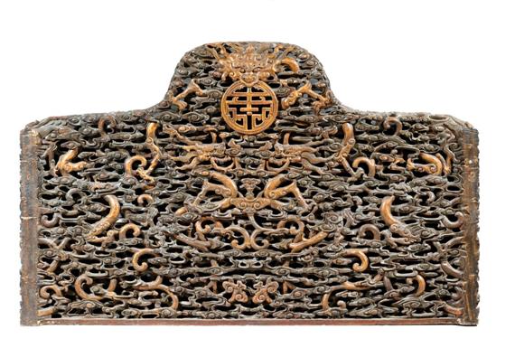 Appraisal: A WOODEN BACKREST OF A THRONE CARVED WITH DRAGONS AMONGST