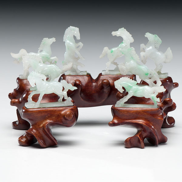 Appraisal: Chinese A set of eight carved green jadeite horses with