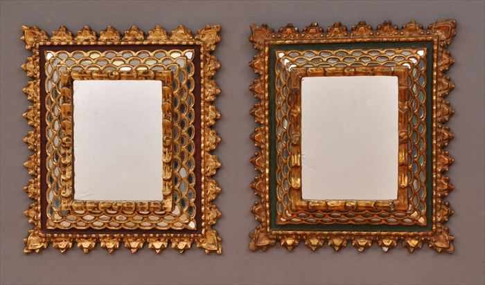 Appraisal: PAIR OF SPANISH COLONIAL-STYLE CARVED PAINTED AND PARCEL-GILT WALL MIRRORS