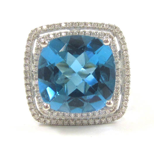 Appraisal: BLUE TOPAZ DIAMOND AND FOURTEEN KARAT GOLD RING The white