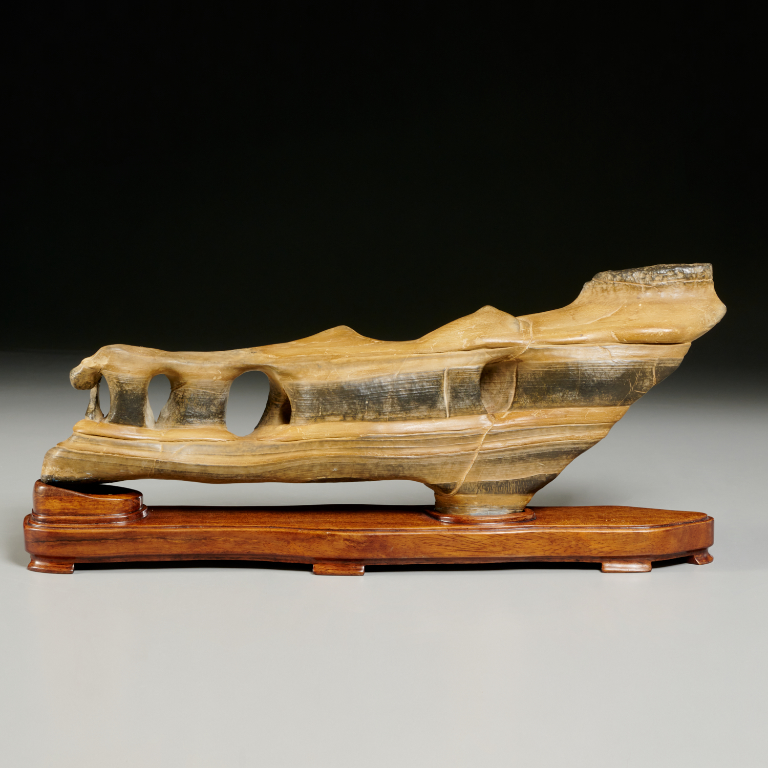 Appraisal: CHINESE SCHOLAR'S ROCK Of long low form with horizontal band