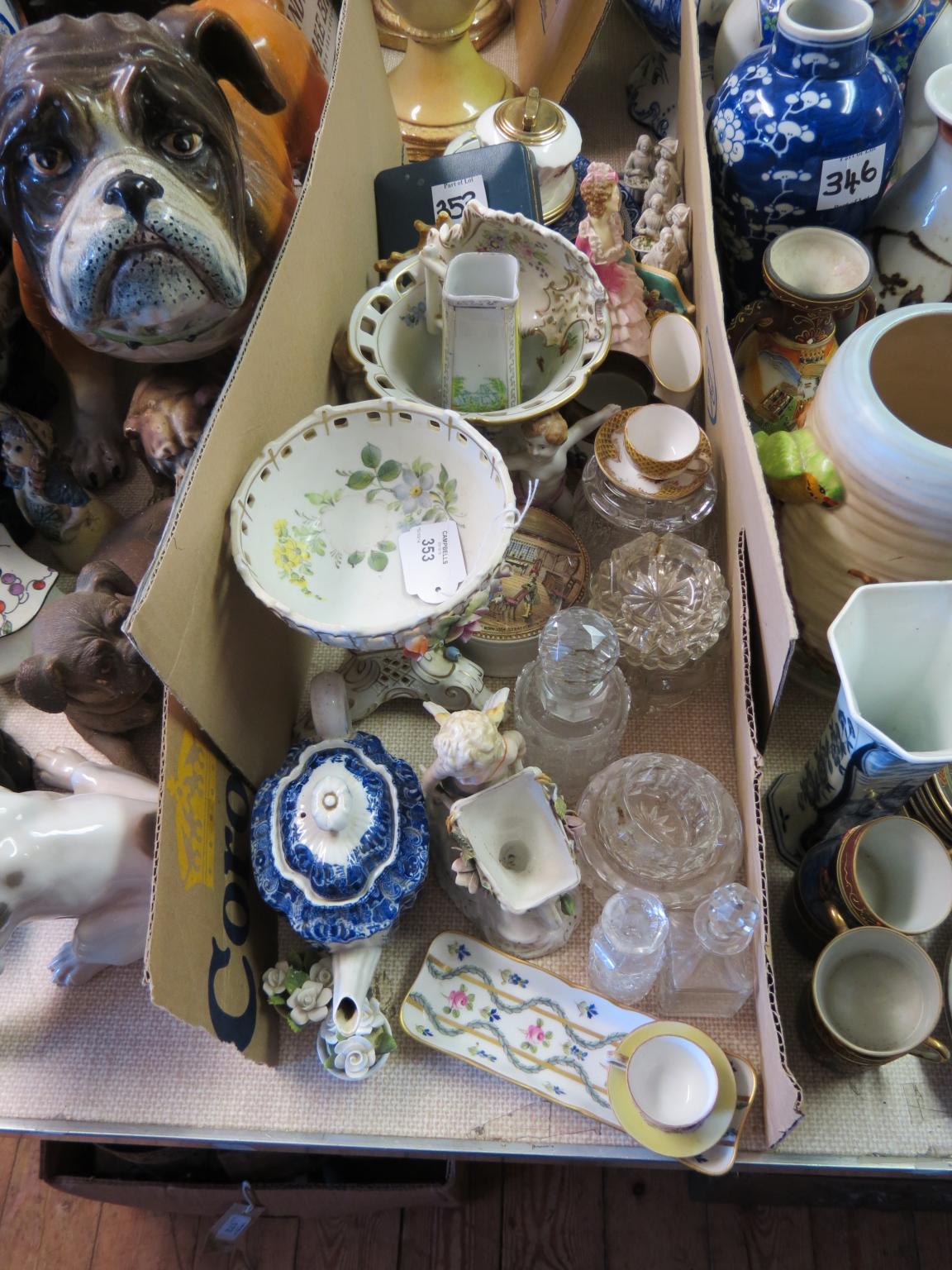 Appraisal: A German porcelain centrepiece on triform base cherub with wheelbarrow