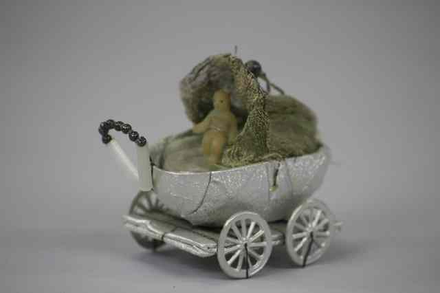 Appraisal: SEBNITZ BABY CARRIAGE Germany Sebnitz baby carriage Christmas tree ornament