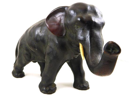 Appraisal: Bronze sculpture of striding Asian elephant with white tusks green