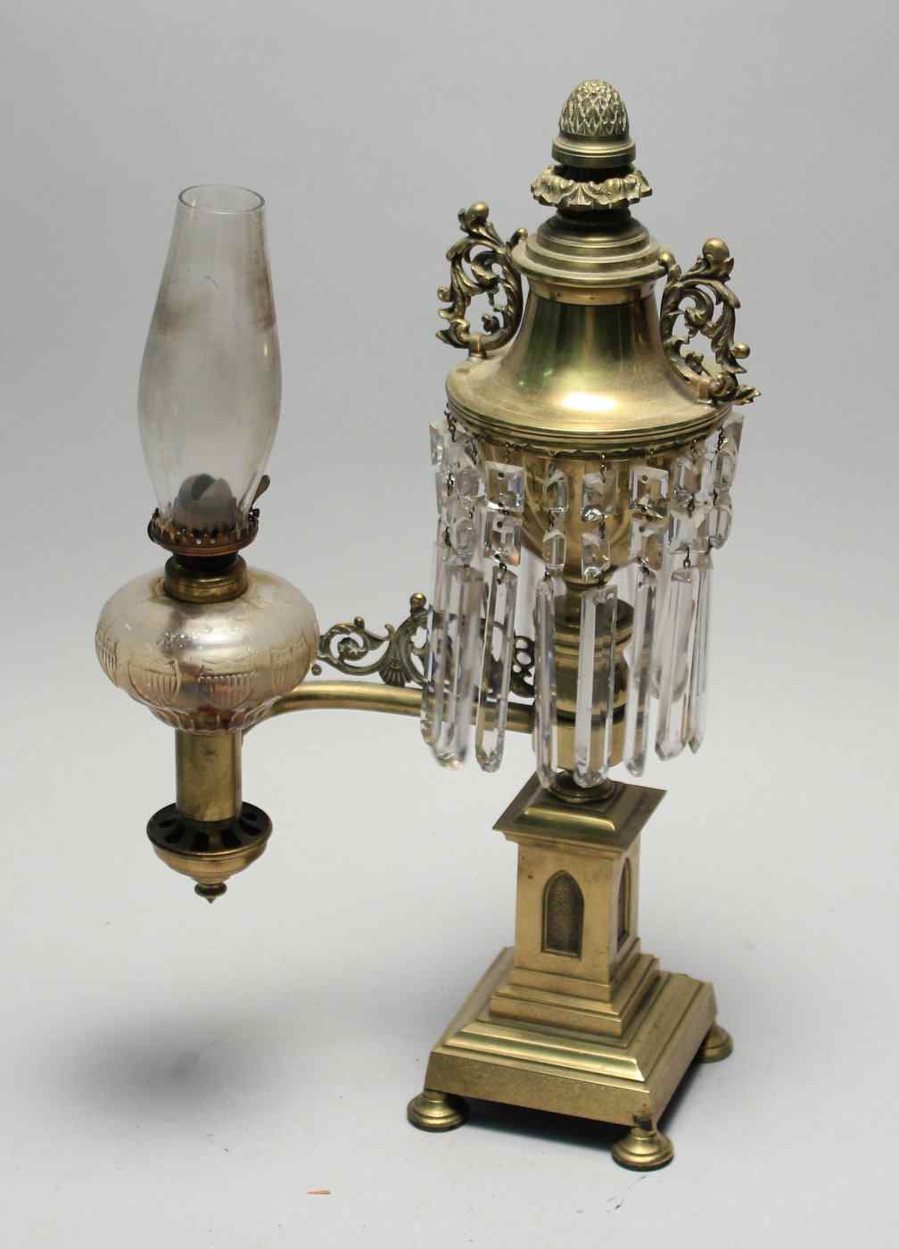 Appraisal: BRASS ARGAND-STYLE LAMPLate th CenturyWith pineapple and rosette-style finial over