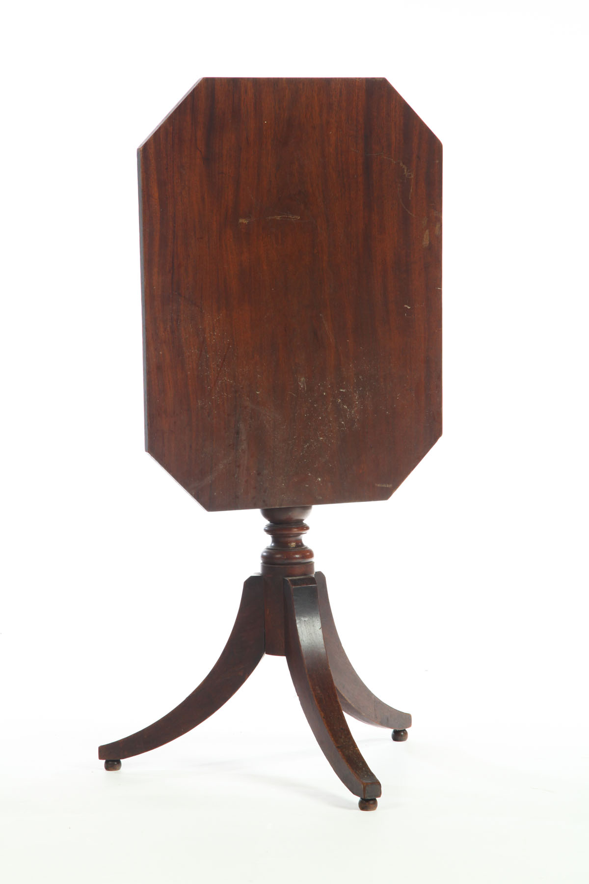 Appraisal: TILT-TOP CANDLESTAND American th century mahogany Octagonal top over turned