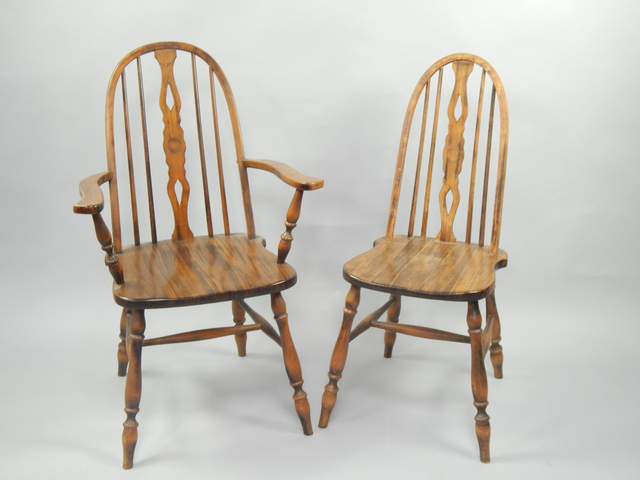 Appraisal: An oak armchair and two beech spindle back chairs