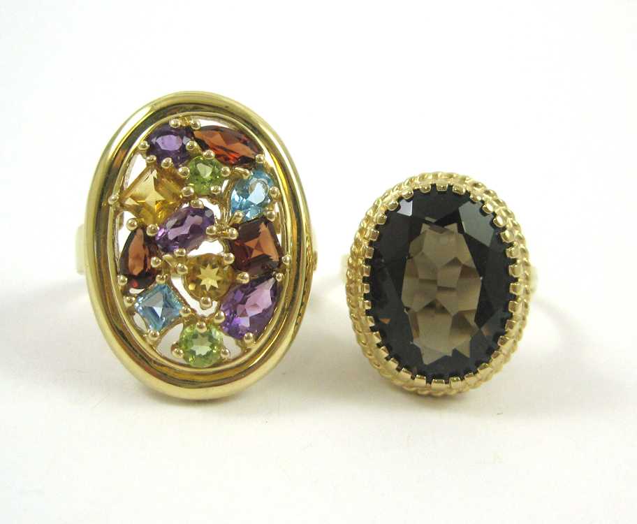 Appraisal: TWO COLORED GEMSTONE AND YELLOW GOLD RINGS including a size