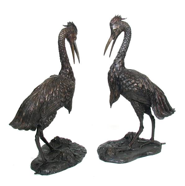 Appraisal: A pair of patinated bronze figures of birds height in