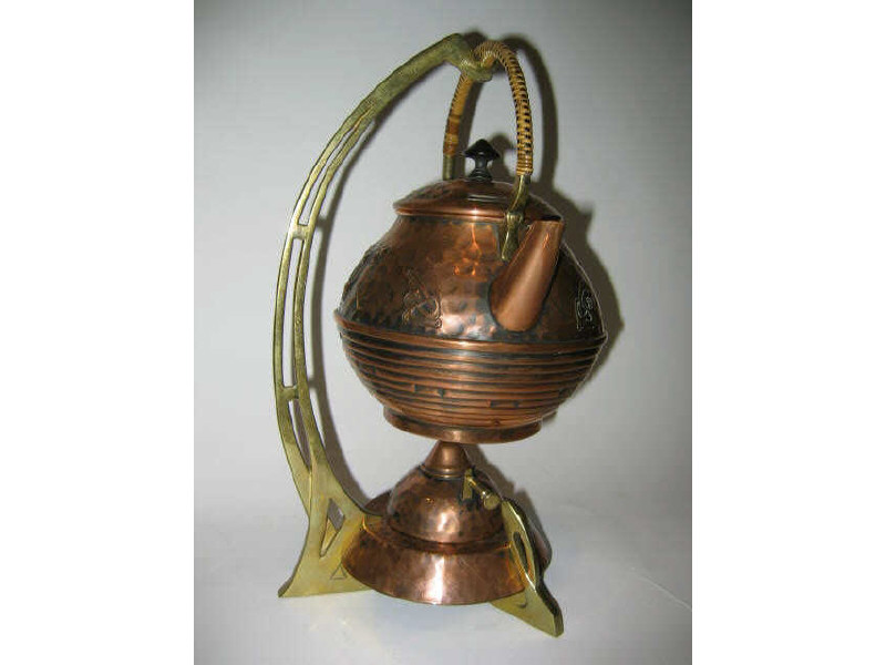 Appraisal: SESSIONIST STYLE BRASS KETTLE ON STAND with hammered finish kettle