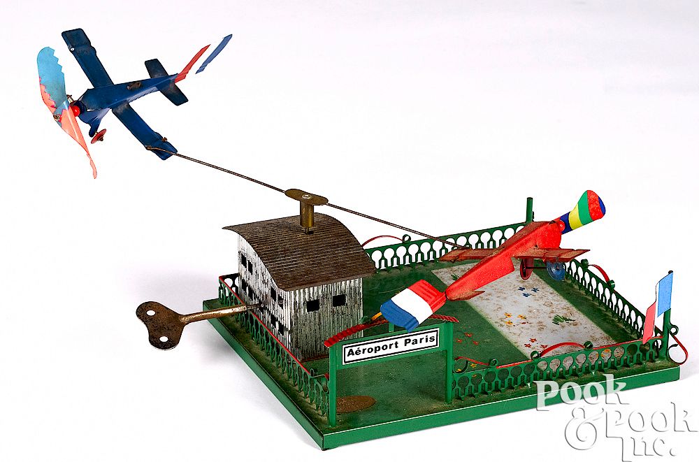 Appraisal: German painted tin Aeroport Paris clockwork toy German painted tin