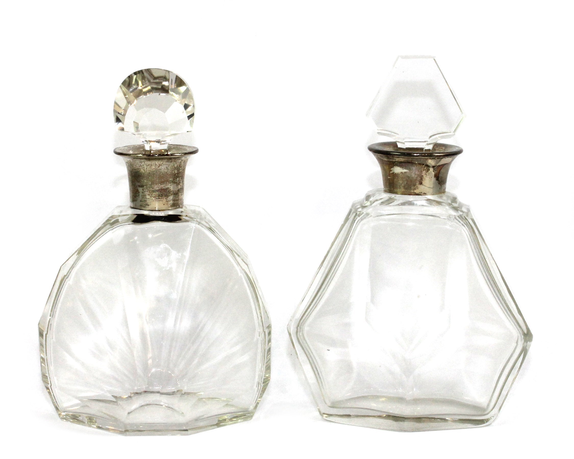 Appraisal: Two silver mounted faceted glass decanters each in a differing