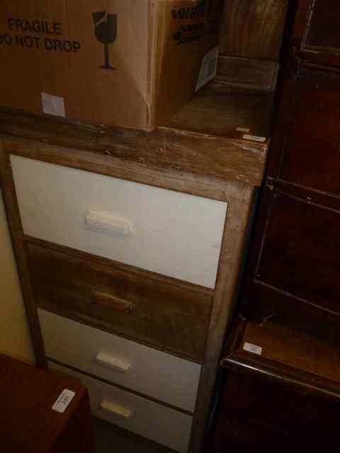 Appraisal: A NARROW LIMED CHEST OF FOUR DRAWERS wide