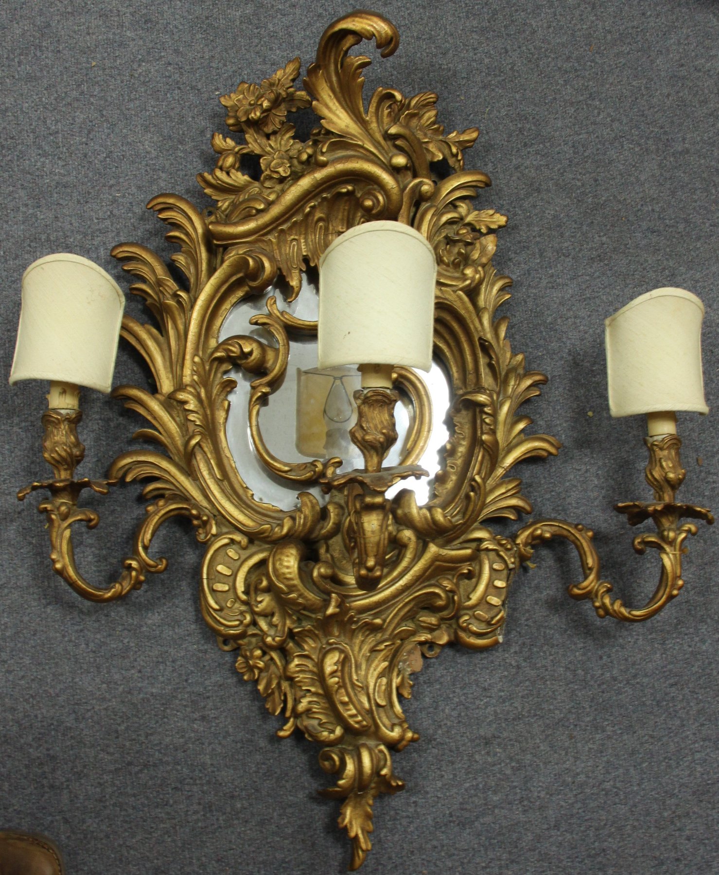 Appraisal: A gilt framed rococo style girandole the scrolling frame around